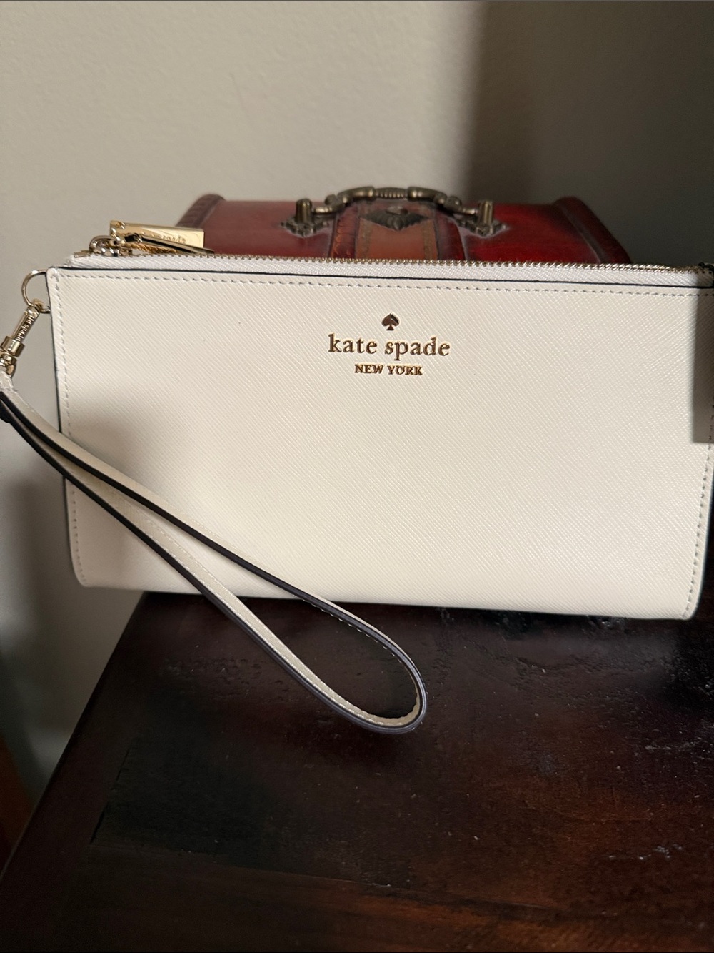 kate spade Cream Zip Wristlet with Gold Logo